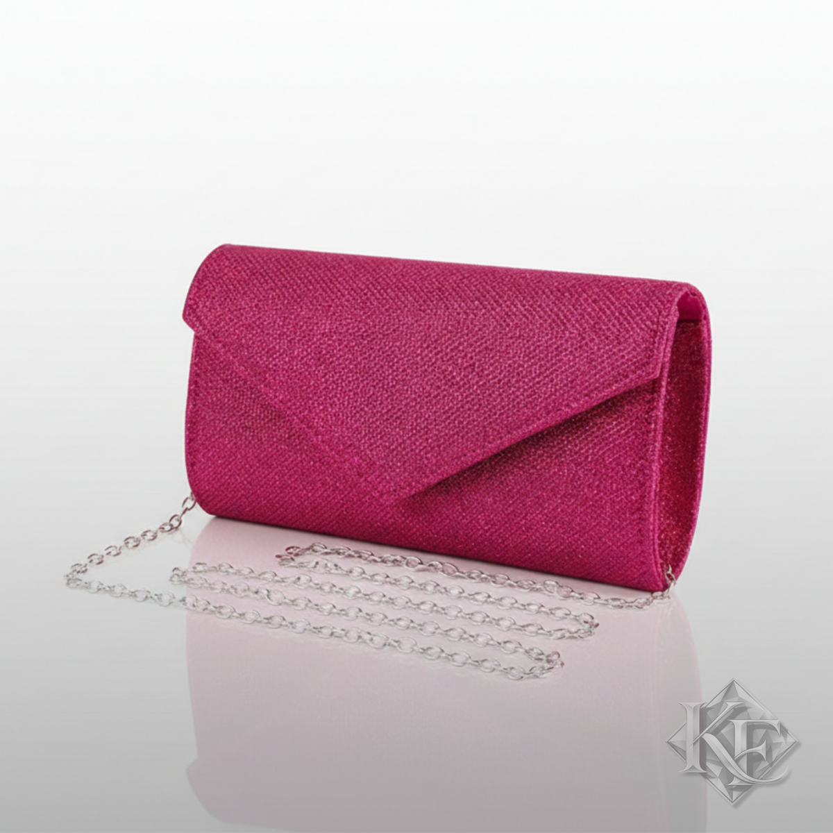 Pink clutch bag with a chain on a light gray background