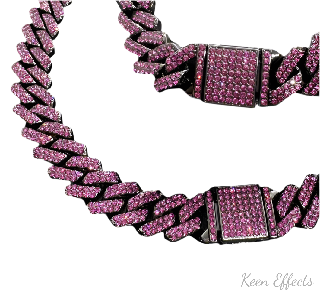 A set of black purple Cuban chains, with purple rhinestones on the buckle and throughout the chain, displayed against a white background.