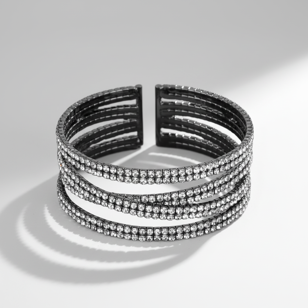 Black and silver bracelet on a reflective surface