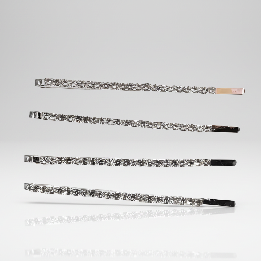 Set of four decorative hair pins on a light gray background.