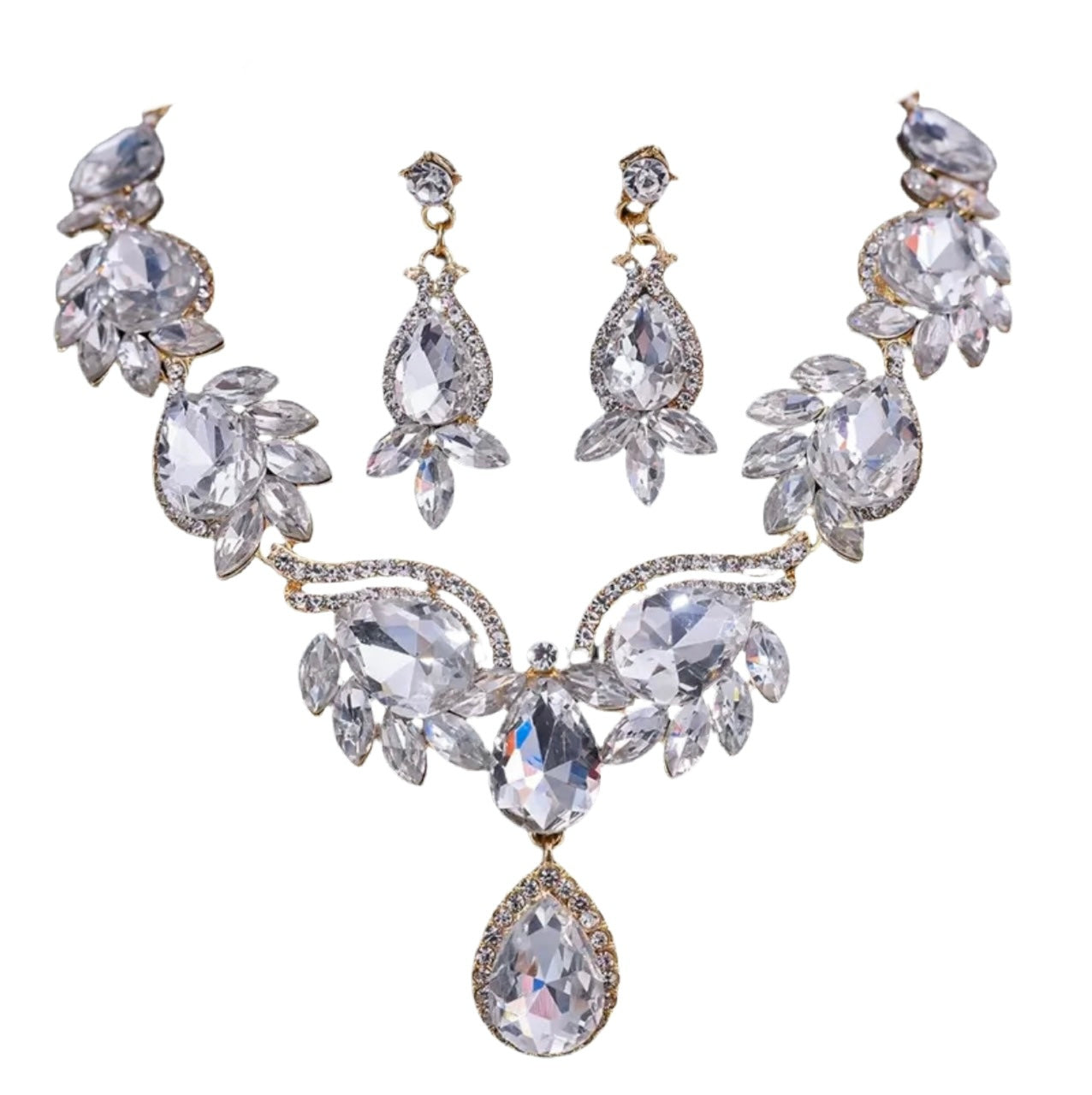 A gold tone alloy jewelry set with large clear rhinestones, including a necklace and earrings with teardrop designs.