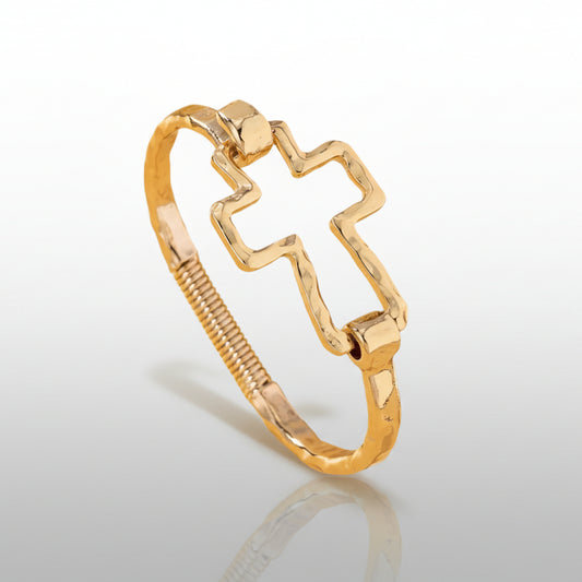 Gold ring with a unique design on a white background