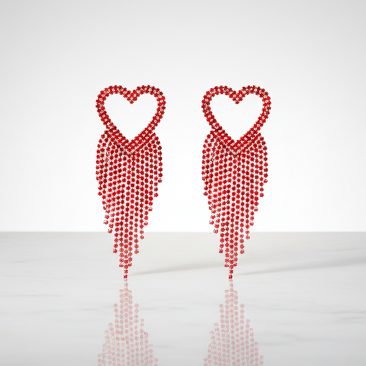 Two red heart-shaped earrings on a white background