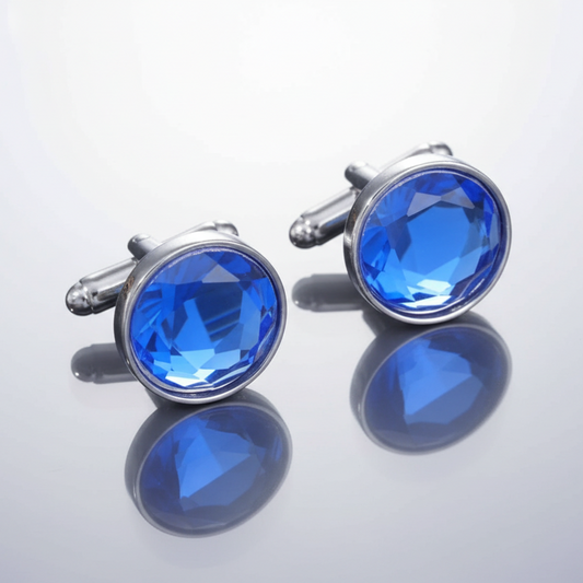 Pair of blue gemstone cufflinks on a light gray background