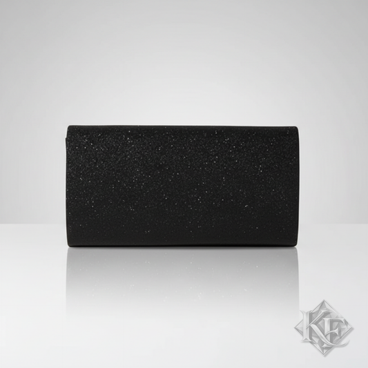 Black glittery clutch bag on a light gray background