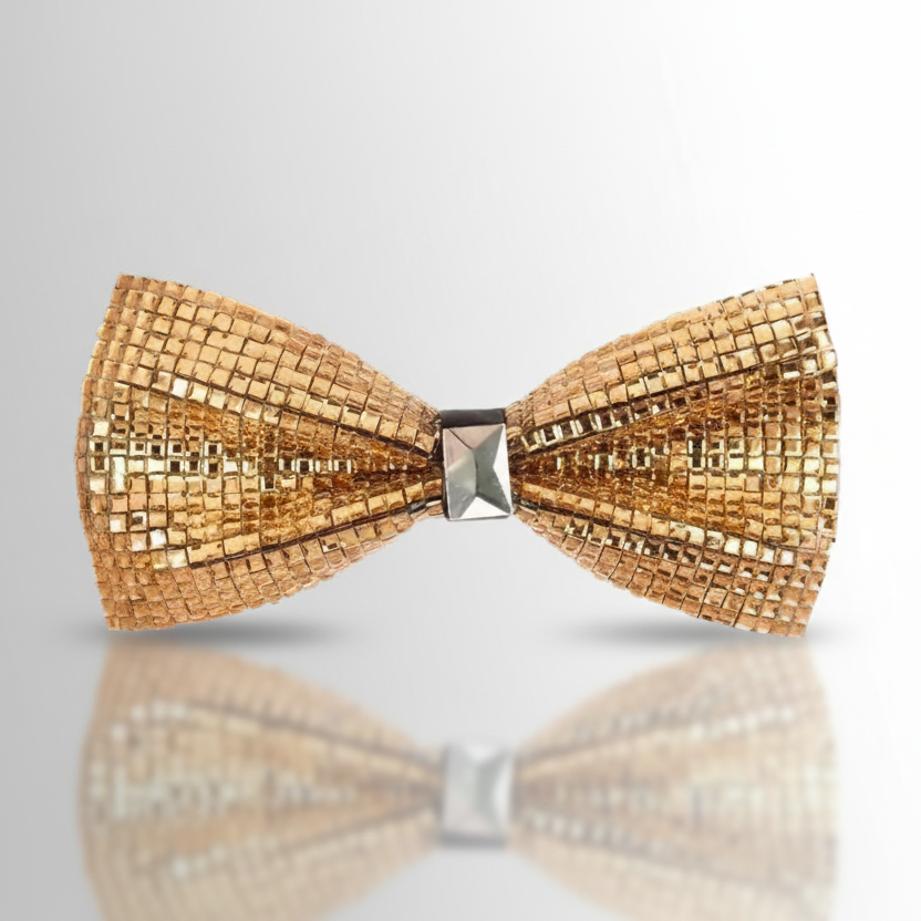 A golden bow tie embellished with beaded patterns and a rhinestone center