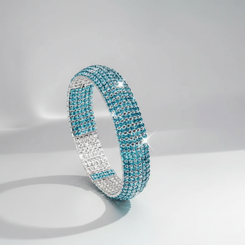 Turquoise and silver bracelet on a light gray background