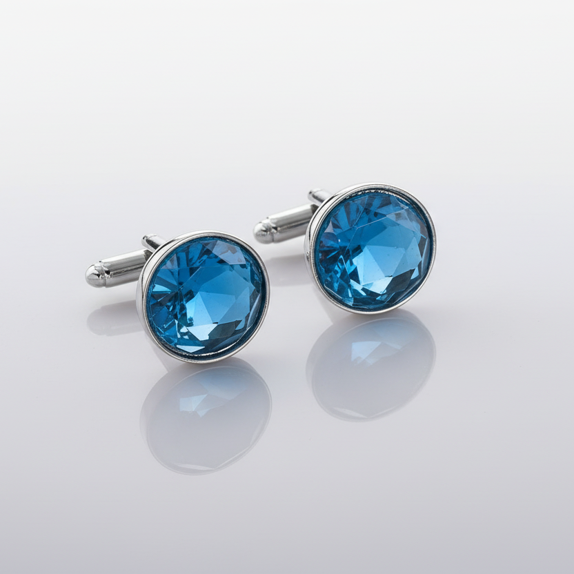 Pair of blue gemstone cufflinks on a gray background