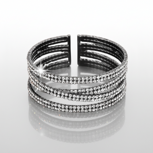 Black and silver bracelet with rhinestones on a white background