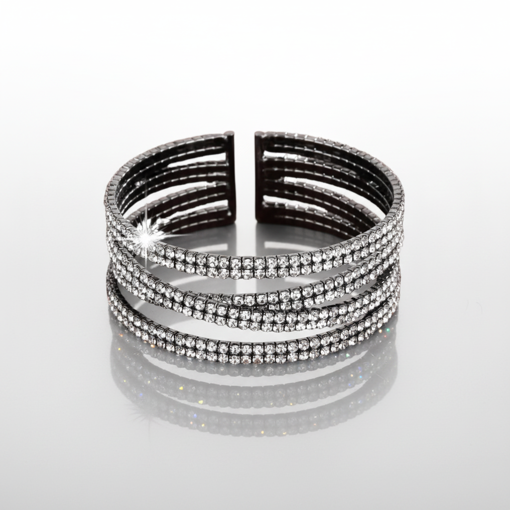 Stack of black and silver bangles on a white background