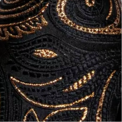 Close-up of black fabric with gold embroidery