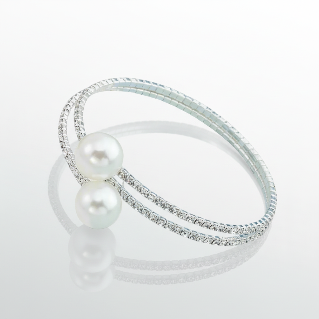 Silver bracelet with pearls on a white background