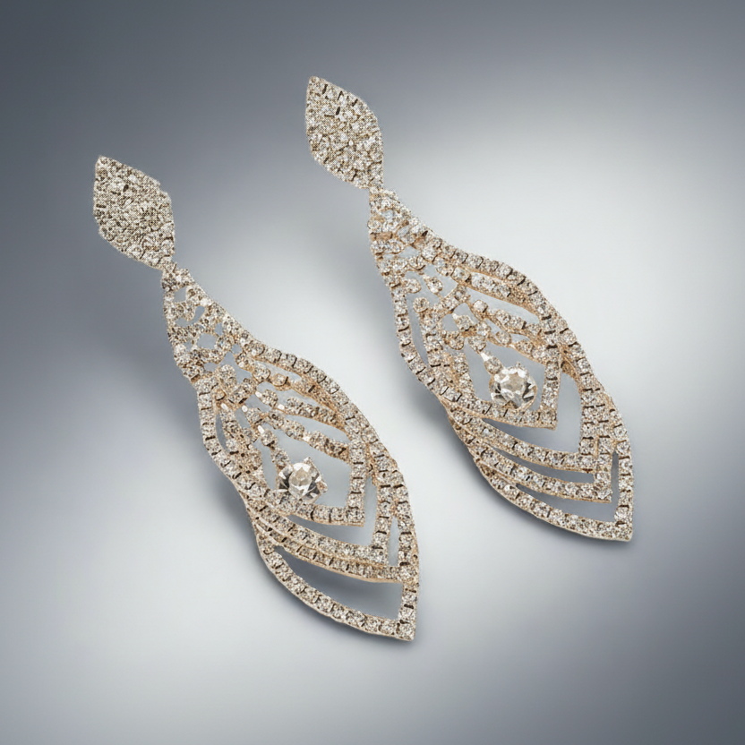 Pair of diamond earrings on a gradient gray background