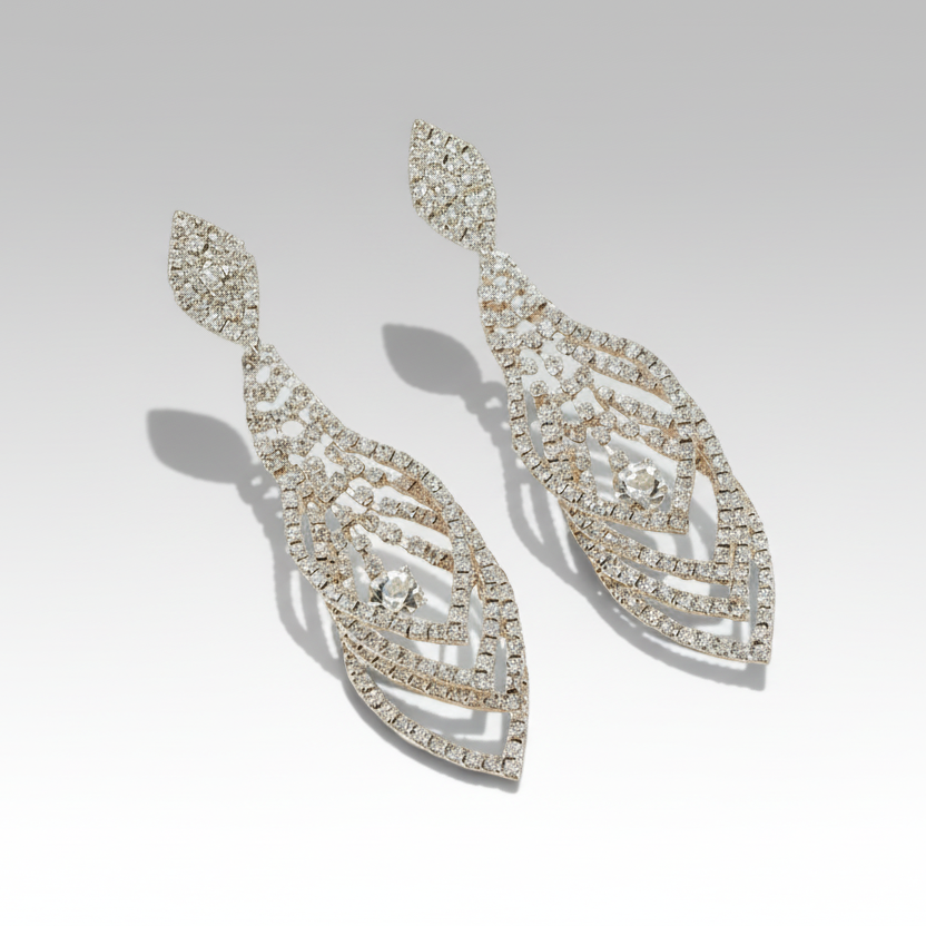 Pair of diamond earrings on a gray background