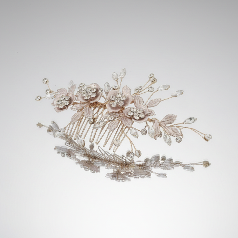 Decorative hair comb with floral and leaf details on a light gray background