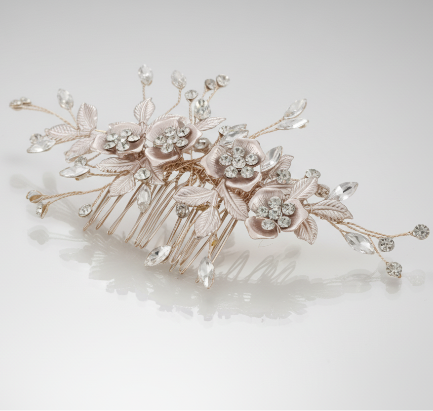 Decorative hair comb with floral and leaf designs on a light background