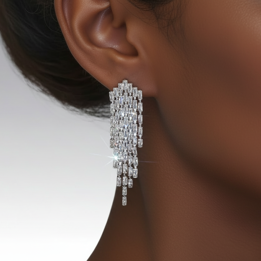 Close-up of a diamond earring on an ear with a blurred background
