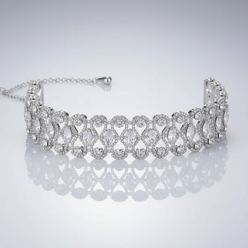 Silver bracelet with clear stones on a light gray background