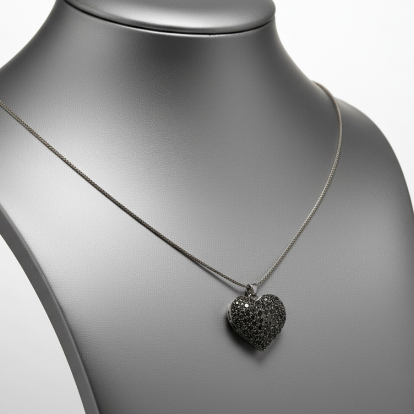 Heart-shaped pendant necklace on a mannequin bust