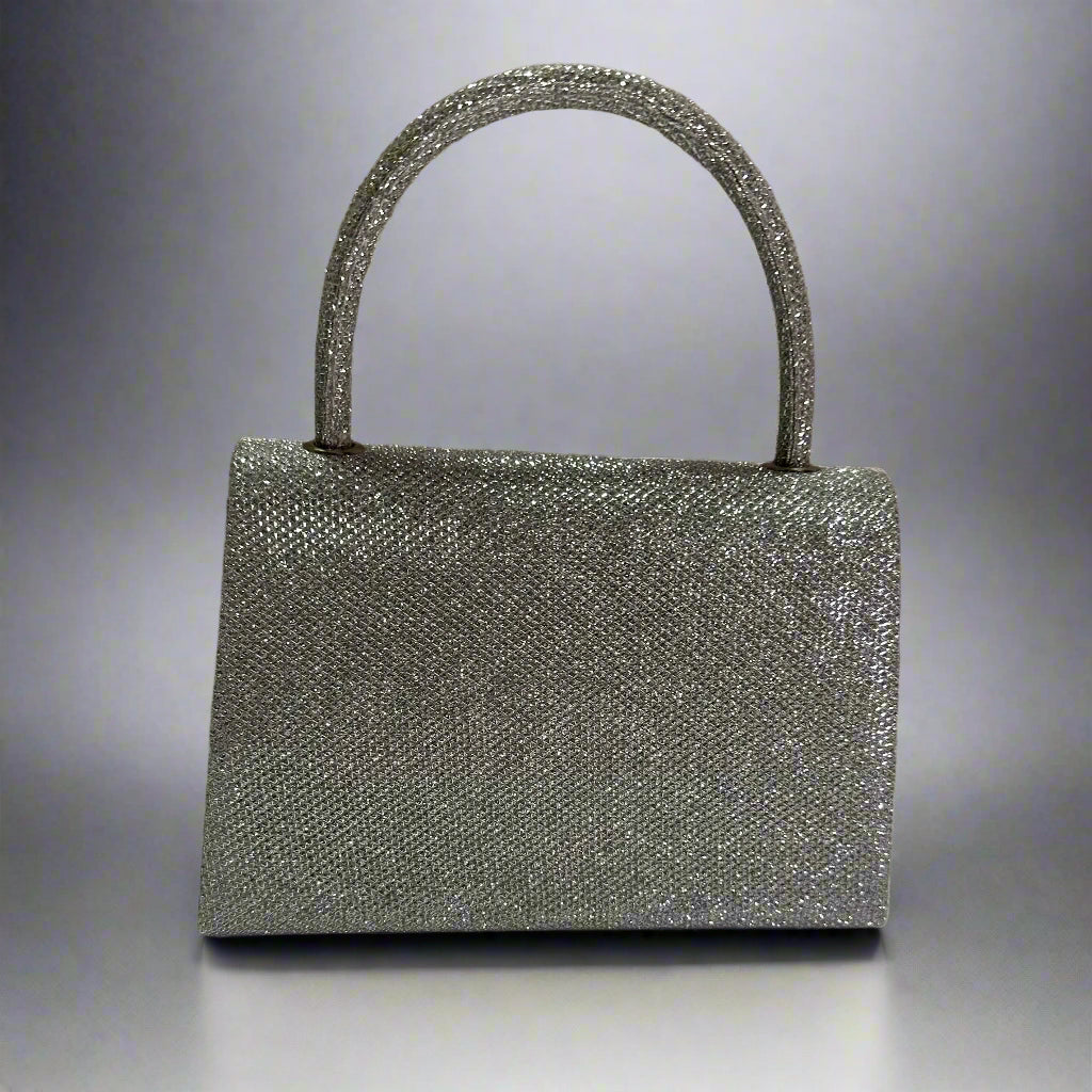 Silver glitter handbag on a neutral background