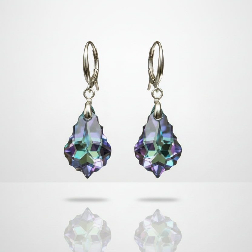 Pair of earrings with purple teardrop-shaped gemstones on a light gray background