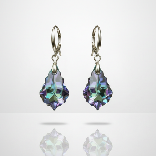 Pair of earrings with purple teardrop-shaped gemstones on a light gray background