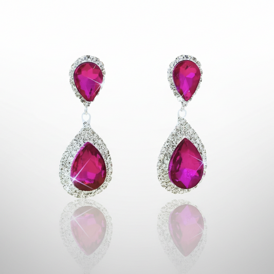 Pair of earrings with pink gemstones on a white background
