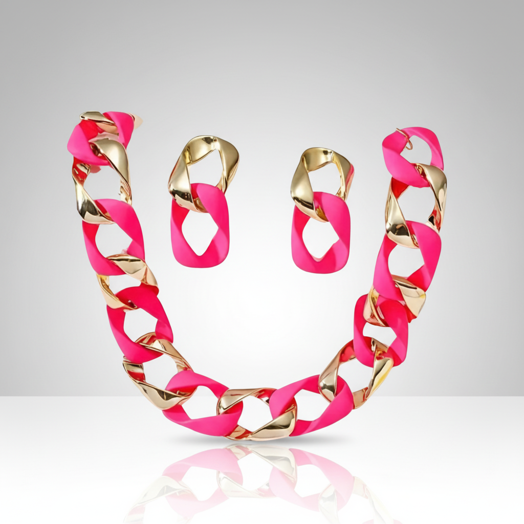 Necklace and earrings set with pink and gold links on a reflective surface.