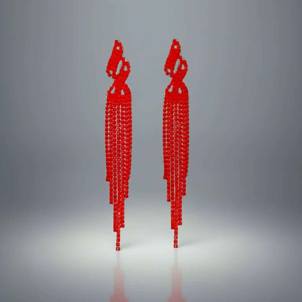 Pair of red earrings on a gray background