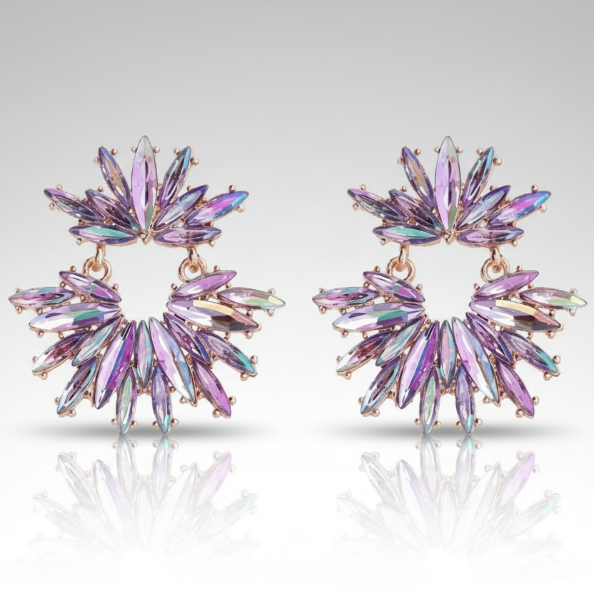 Pair of colorful star-shaped earrings on a light gray background