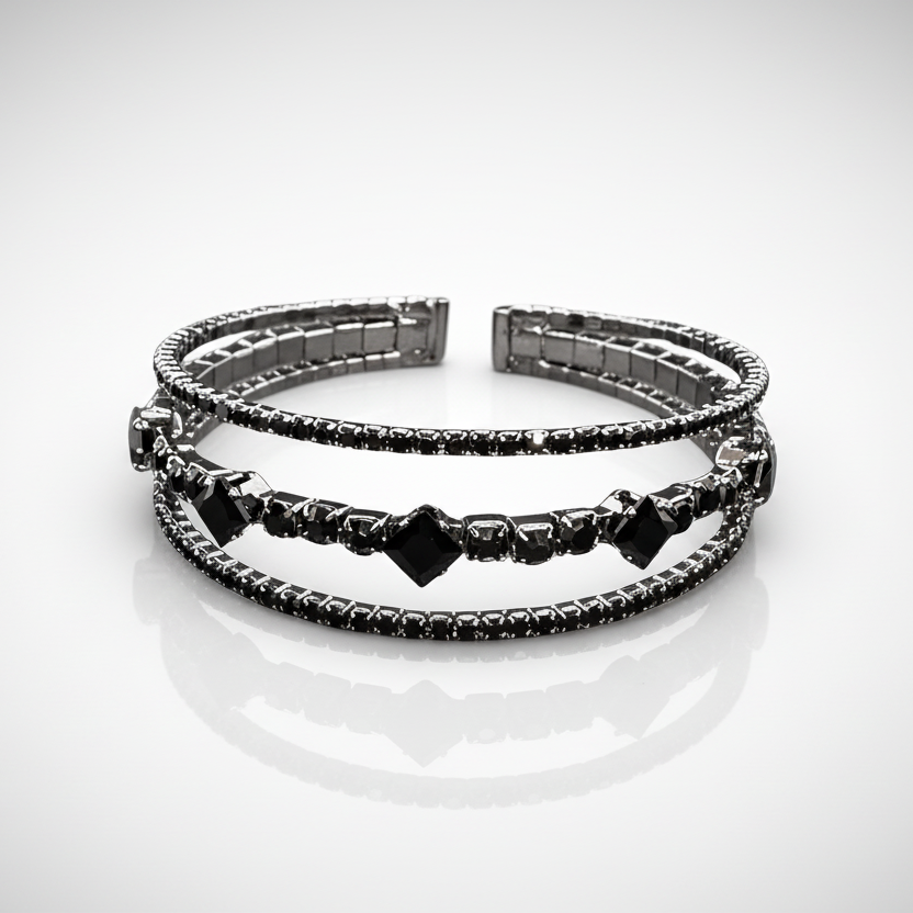 Stack of black beaded bracelets on a white background