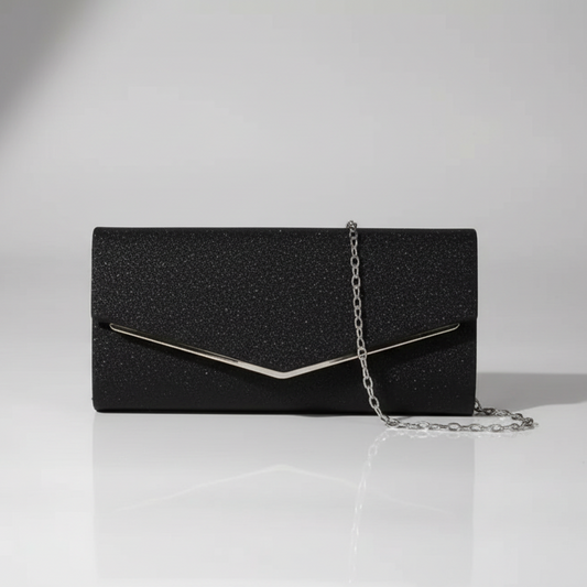Black glittery clutch bag with a chain strap on a white surface.