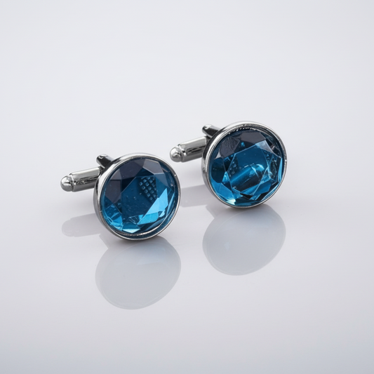 Cufflinks with blue gemstones on a white background