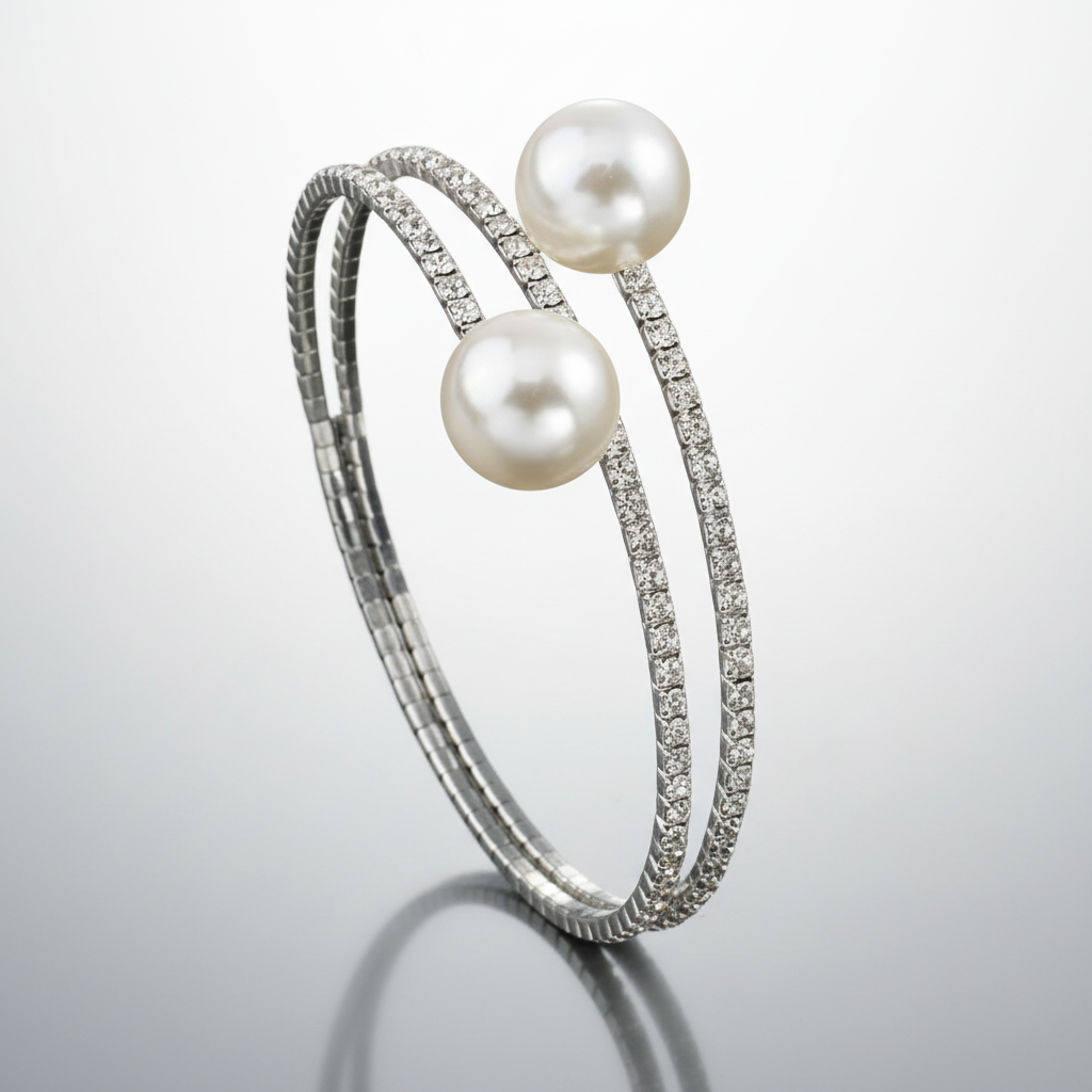 Silver bracelet with pearls on a reflective surface
