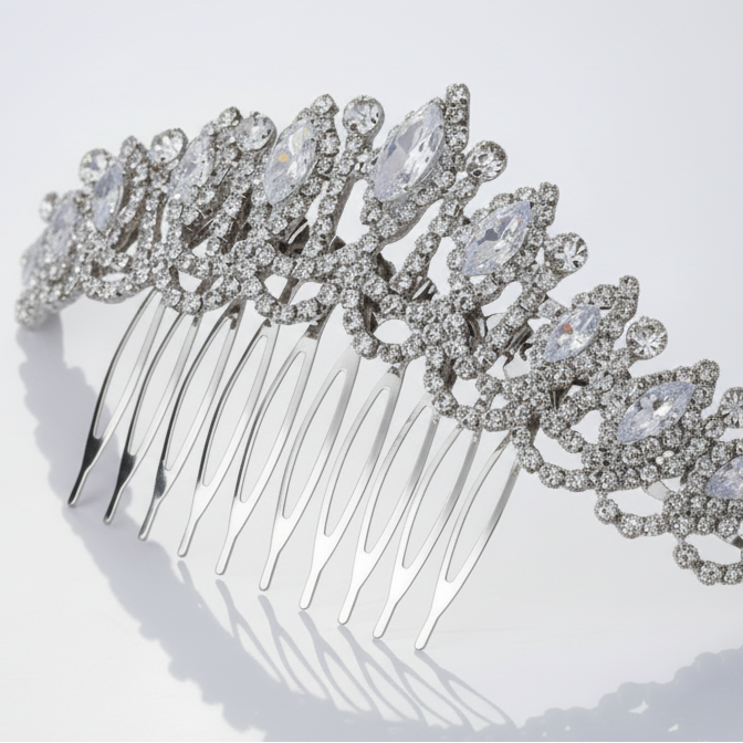 Silver hair comb with crystal embellishments on a white background