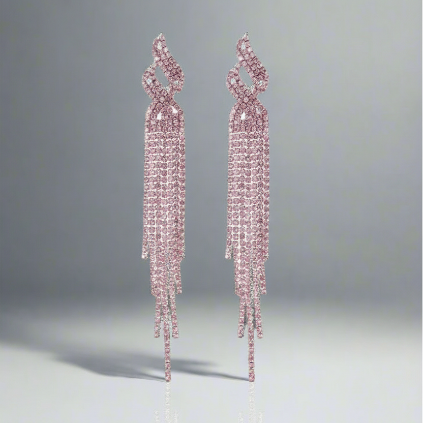 Pair of pink diamond earrings on a gray background