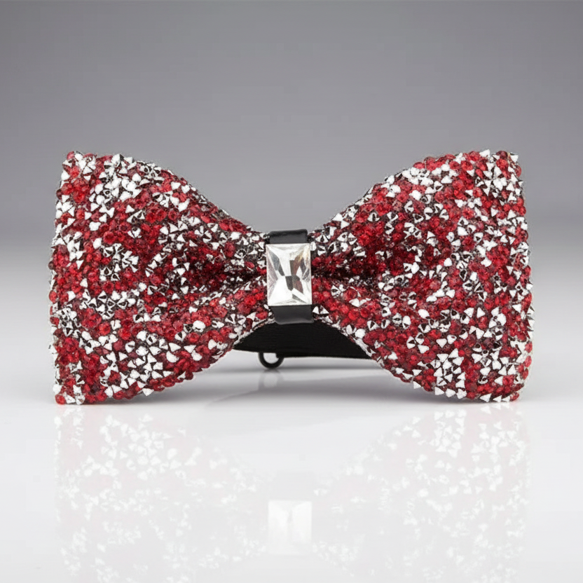 A red and silver rhinestone-studded bowtie with an acrylic non-textile material.