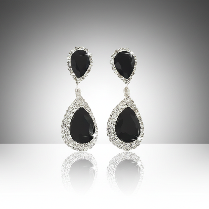Pair of black teardrop earrings with silver accents on a white background
