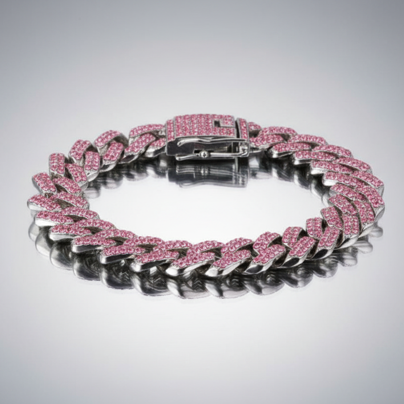 Pink diamond bracelet on a reflective surface with a gray background