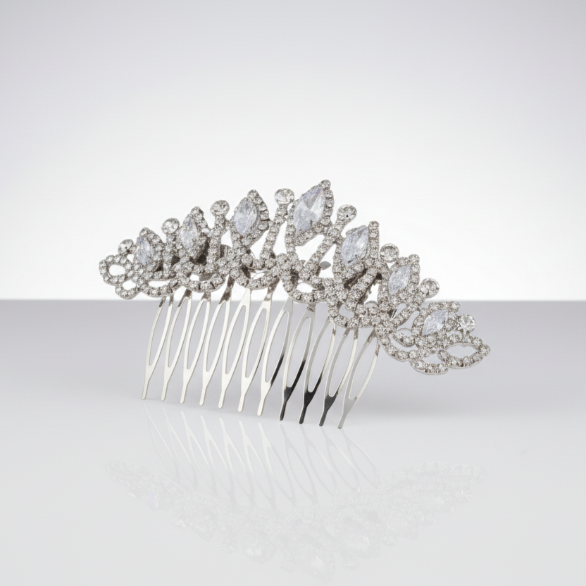 Silver hair comb with crystal embellishments on a white background