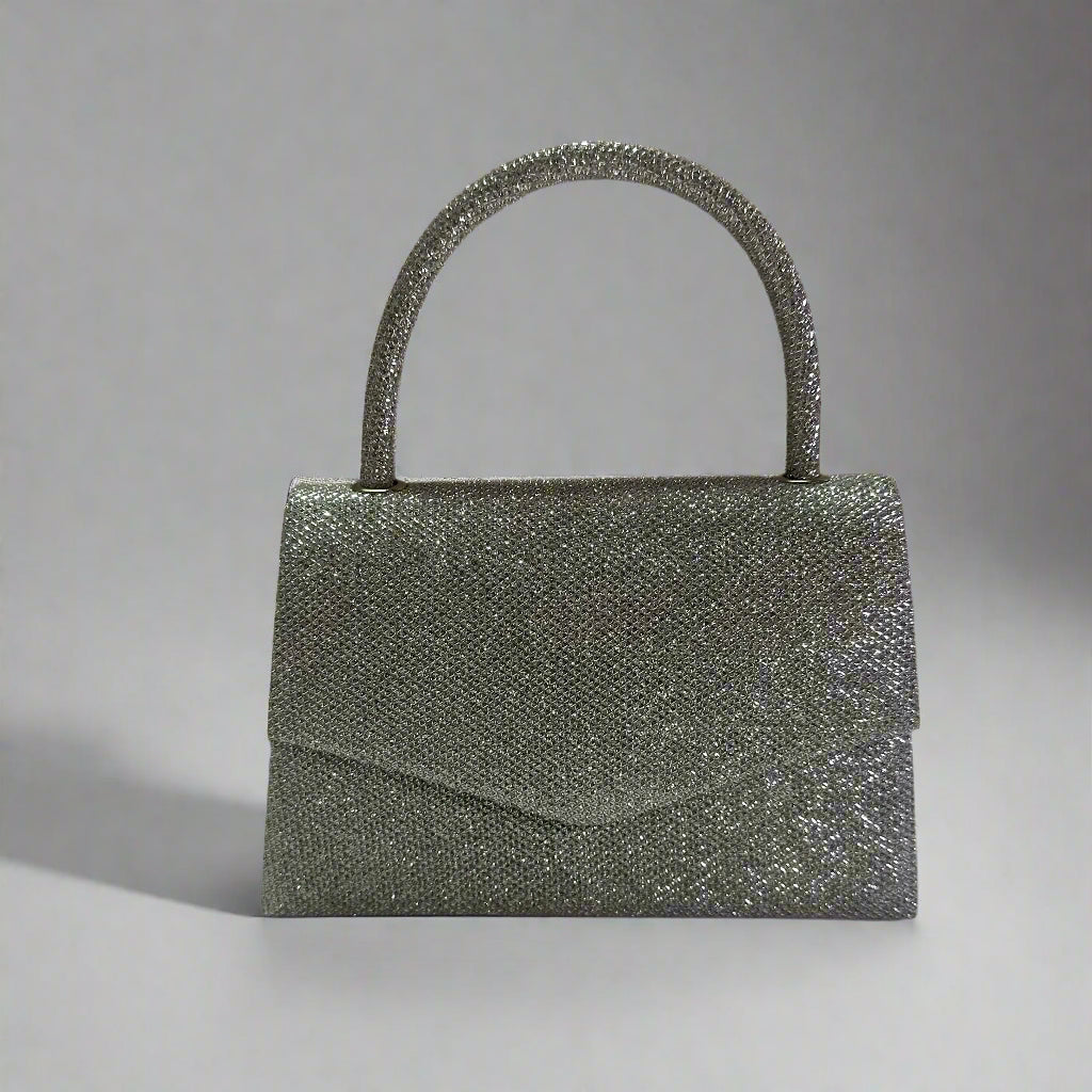 Silver glitter handbag on a neutral background
