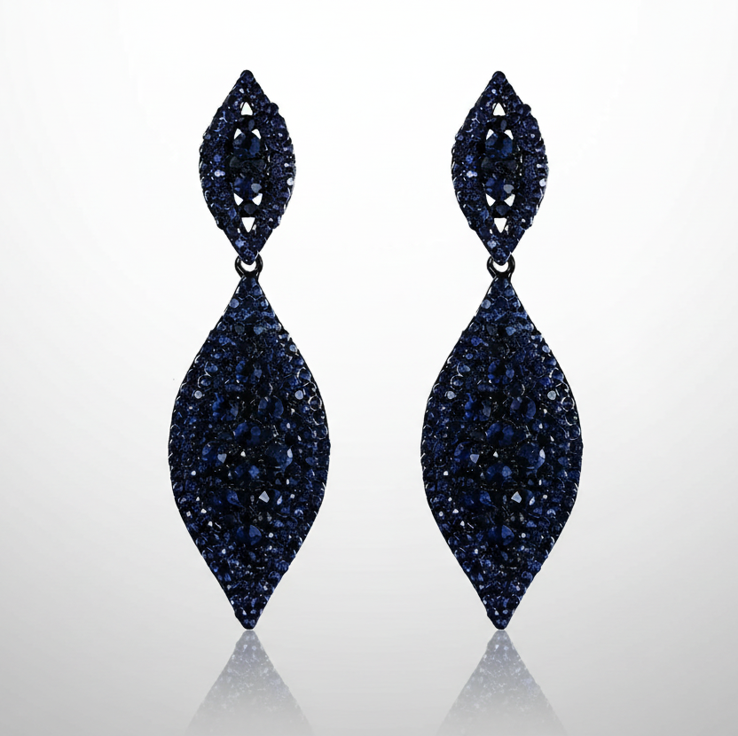 Pair of blue gemstone earrings on a white background