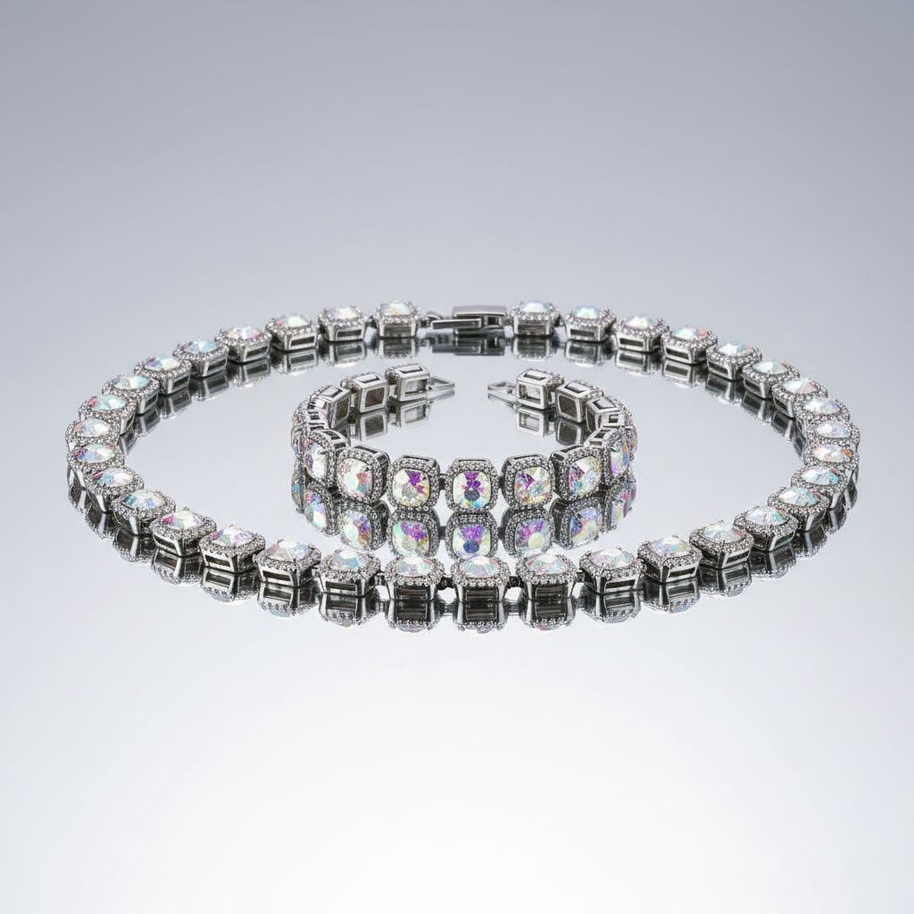 An iridescent rhinestone jewelry set consisting of a necklace and a bracelet with a metallic clasp.