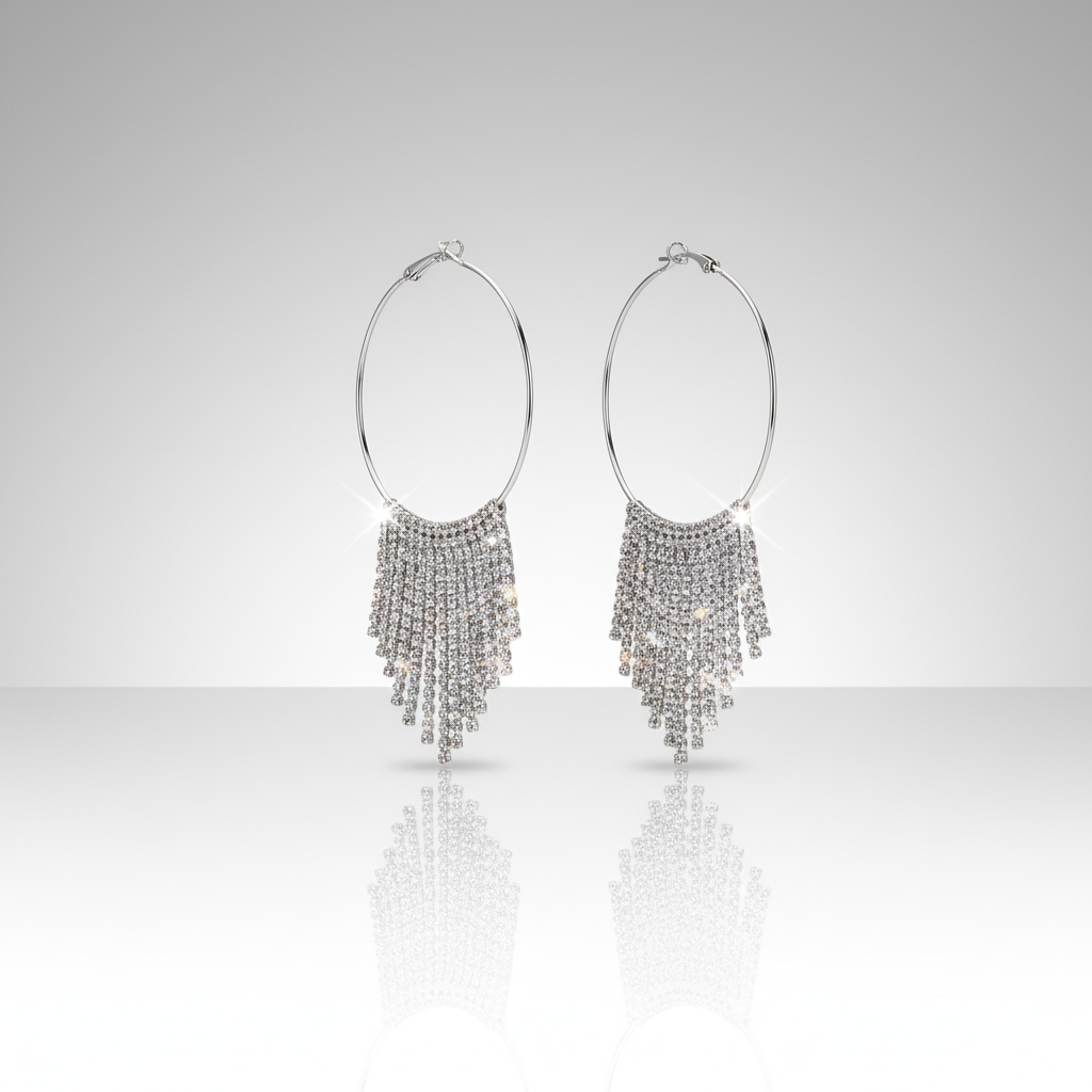 Pair of silver hoop earrings with fringe on a white background