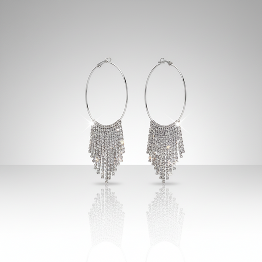 Pair of silver hoop earrings with fringe on a white background